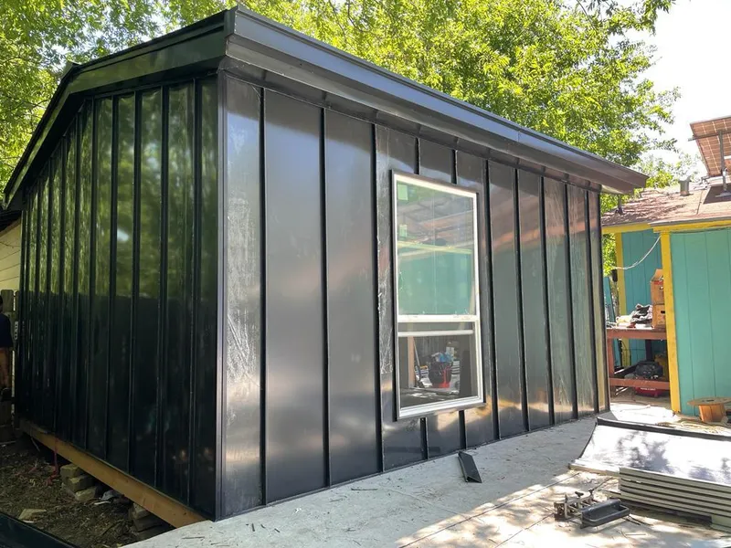 Black standing seam metal wall panels for Roof Inspection in Englewood